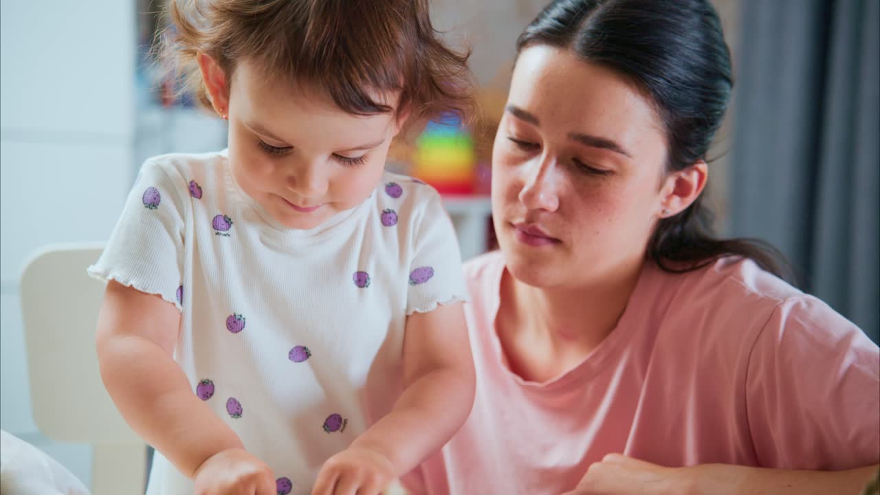 Engaging Mother and Child in Creative Play: A Heartwarming Interaction as They Explore Crafts and Art Materials Together at Home, Strengthening Their Bond