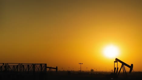 oil pumps time lapse at sunset - zoom out