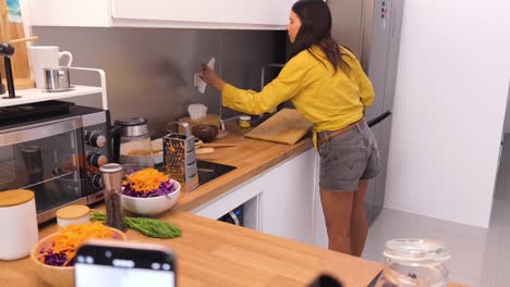 woman cooking a healthy salad in the kitchen