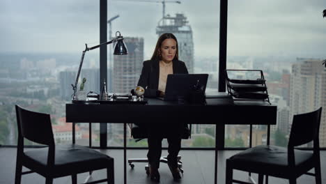 Female-employee-using-laptop-computer