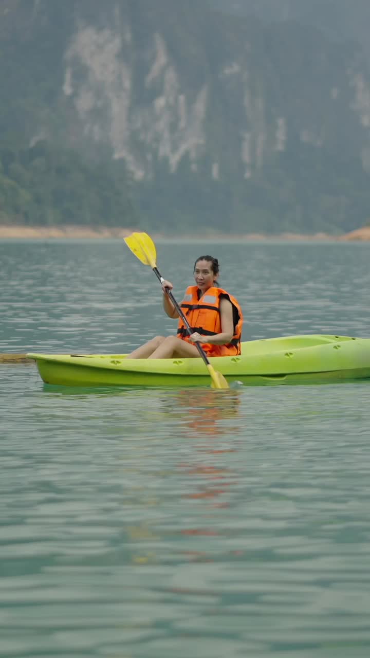 Woman kayaking on a lake