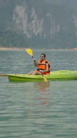 woman kayaking on a lake