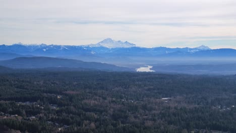 distant snowy mount baker seen from greater vancouver area aerial