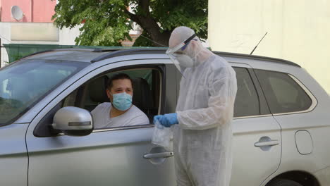 Medical-worker-taking-nose-swab-sample