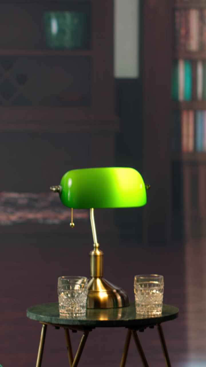 Classic Green Banker's Lamp and Glasses on a Side Table