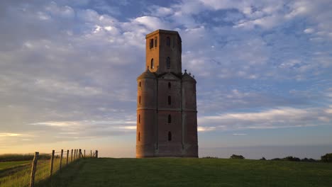 horton tower, gothic tower built in 1750, dorset, england, at sunrise