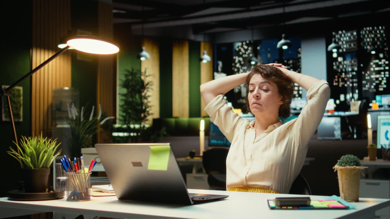Vertical Video Tensed businesswoman stretching her upper back and neck muscles