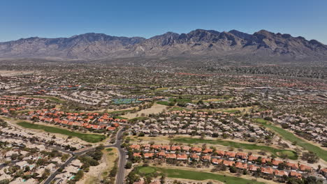 Tucson-Arizona-Aerial-v8-high-rising-drone-flyover-Oro-Valley-Canada-Hills-neighborhoods-capturing-El-Conquistador-golf-course-and-desert-mountainscape-views---Shot-with-Mavic-3-Cine---March-2022