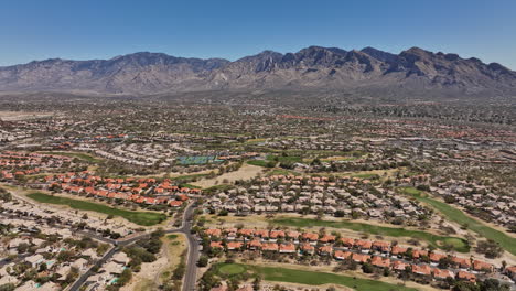 tucson arizona aerial v8 high rising drone flyover oro valley canada hills neighborhoods capturing el conquistador golf course and desert mountainscape views - shot with mavic 3 cine - march 2022