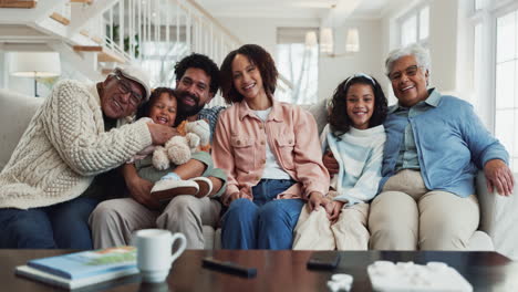 happy family portrait: multi-generational family smiling together on the couch