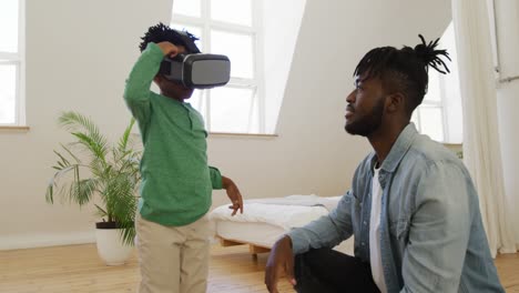 Father-and-son-at-home-using-VR