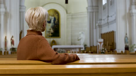 asian man sitting on a bench