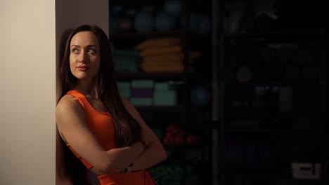 woman in orange fitness outfit