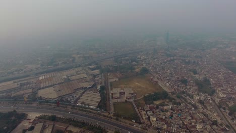 bombay, india, aerial flight of the city, two highways with traffic, foggy weather