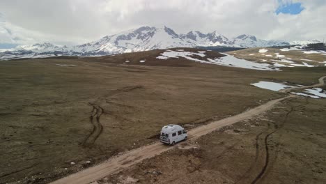 Camper-van-driving-on-a-nature-road-in-the-mountains-in-Montenegro