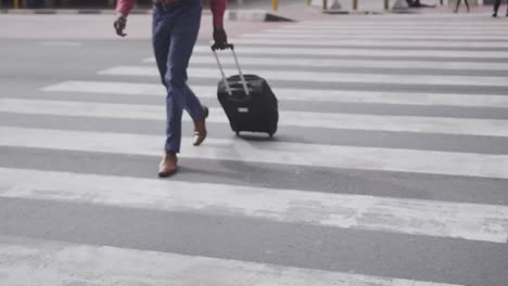 african american man walking on the zebra crossing