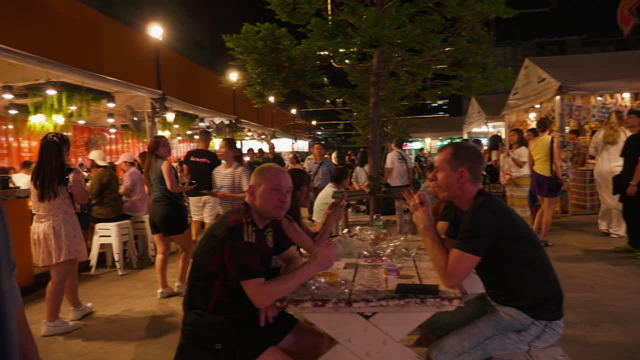 Night Market Scene with Food Stalls and People