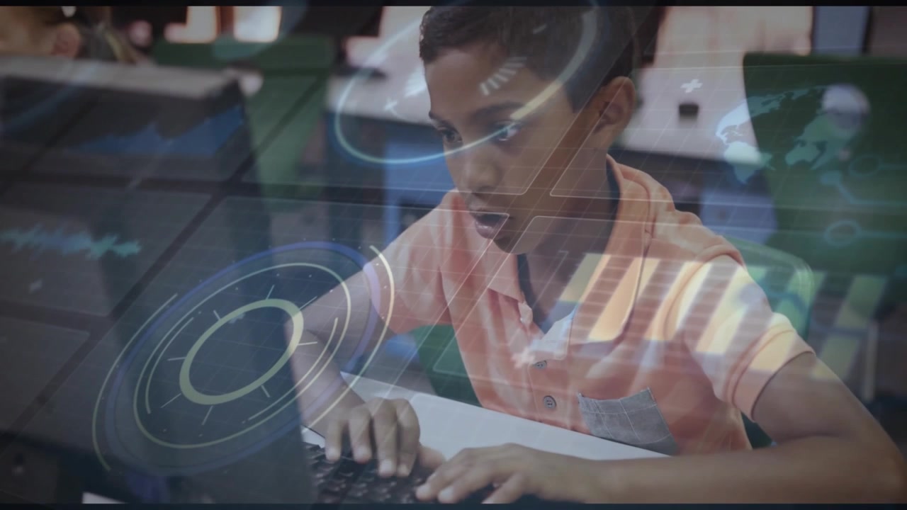 Boy logging onto laptop in classroom, typing, watching holographic charts, map rising in education