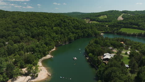 amazing establishing aerial view of peaceful summer lake in hogscald hollow cove