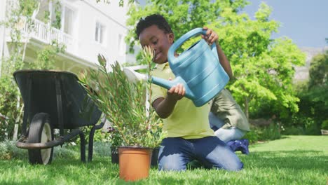 young boy gardening