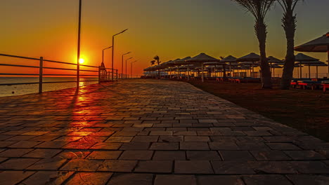 timelapse of ship anchoring at sunset with orange sun in hurghada, egypt
