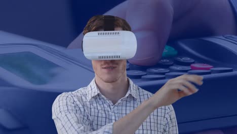 Animation-of-businessman-wearing-vr-headset-touching-virtual-screen-over-payment-terminal