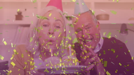video compuesto de confeti dorado cayendo sobre una pareja de ancianos caucásicos celebrando su cumpleaños