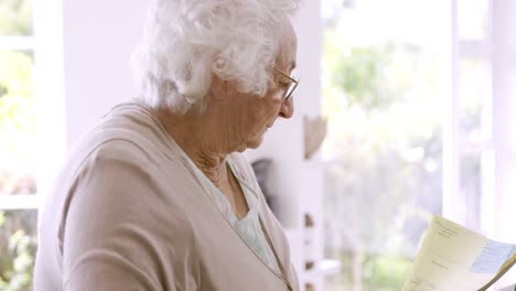 Senior-woman-reading-documents