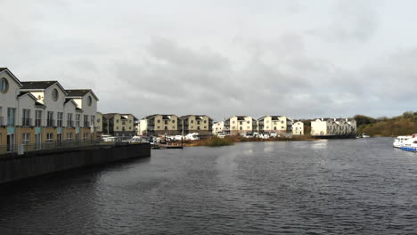 aerial - fly over the lakeside nearby the houses