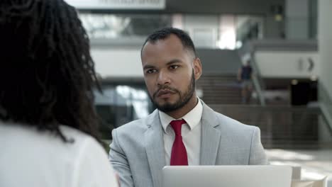 concentrated workers discussing business questions