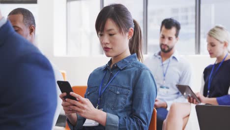 Business-people-attending-to-a-meeting-in-conference-room