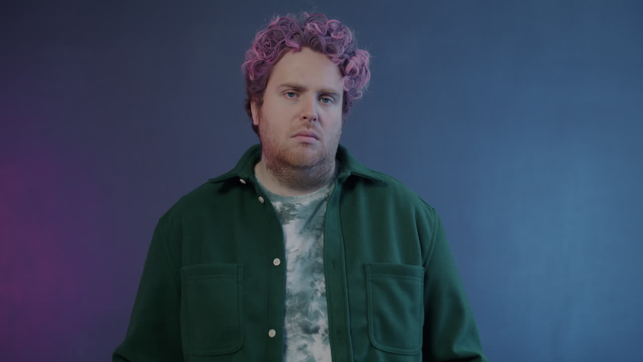 Man with Pink Hair in Green Jacket