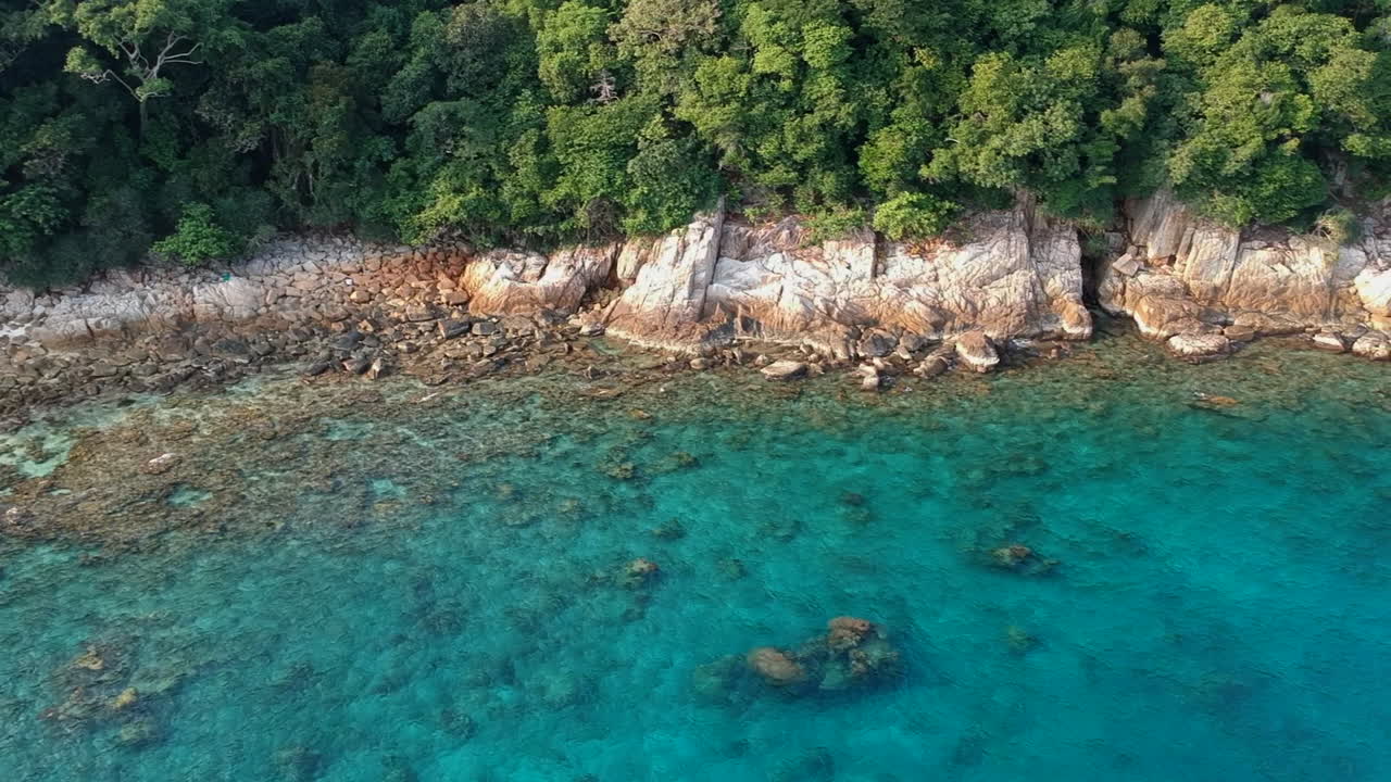 Paradise beach turquoise water perhentian island Malaysia costal rocks Drone
