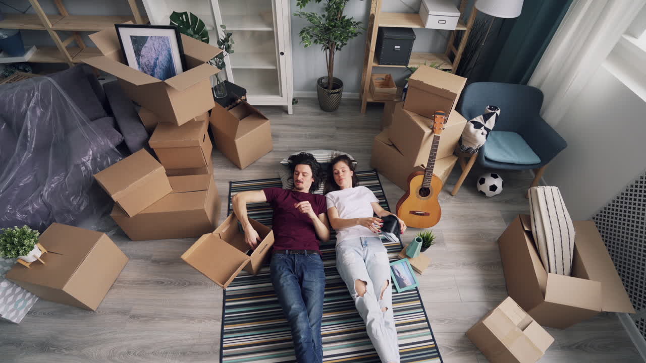 Couple relaxing during their move