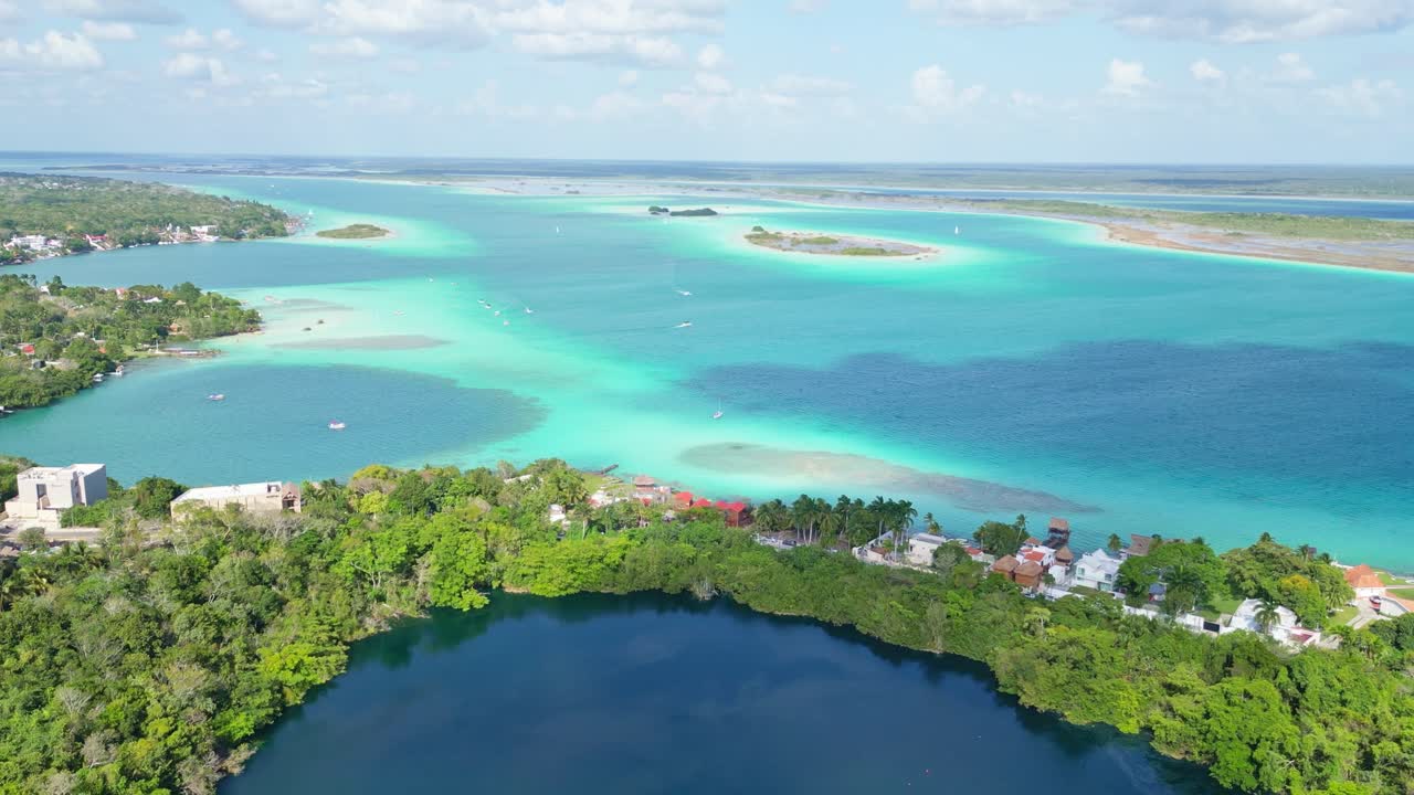 Bacalar lagoon, mexico with clear blue water and lush greenery, aerial view