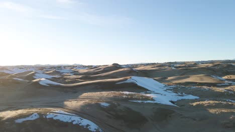 view from drone over sand dunes on winter day, little sahara desert in utah