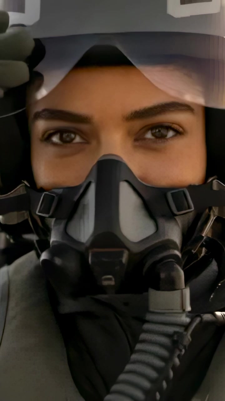 Vertical video: Seeing visor glare, helmeted pilot lifting hand, tilting visor cockpit with O2 mask