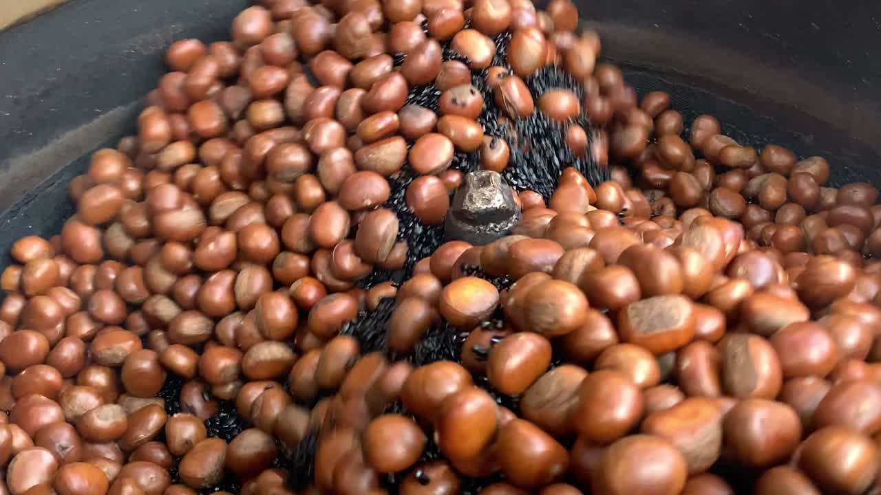 Slow motion of roasting chestnuts