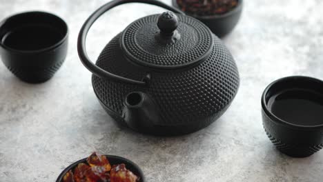 traditional eastern metal teapot and iron cups