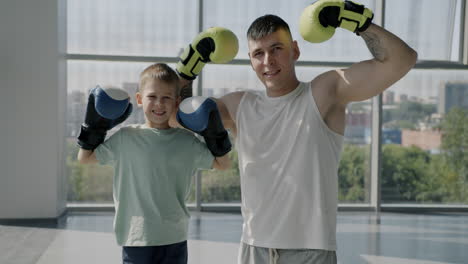 father and son celebrating boxing success