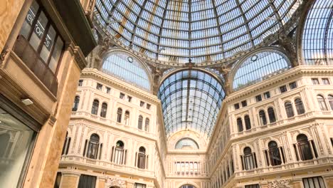 tourists walking inside galleria umberto i, naples