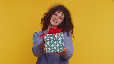 woman presenting birthday gift box stretches out hands, offer wrapped present career celebrate bonus