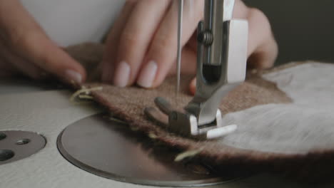 woman sewing on a vintage sewing machine