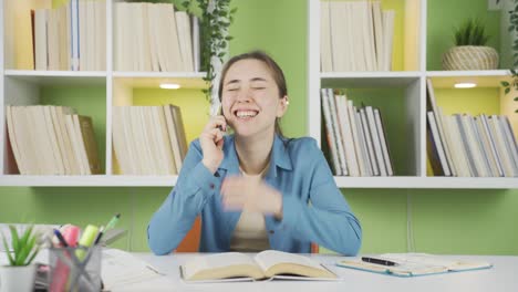 Asian-young-girl-has-a-happy-conversation-on-the-phone.