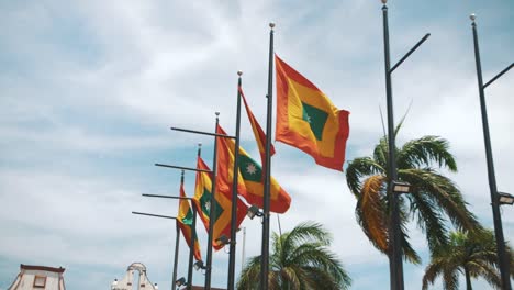 Colorful-waving-flags,-Cartagena-of-the-republic-of-Colombia,-south-America