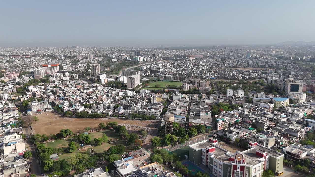 Aerial capture of Jaipur's vibrant street life and crowded neighborhoods.