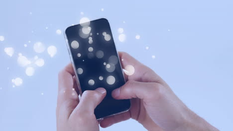 animation of multiple white spots over woman using smartphone on blue background