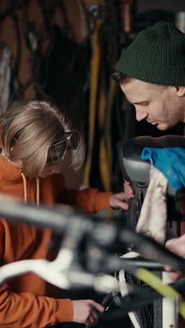 father and son repairing a bicycle
