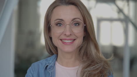 Portrait-of-business-mature-female-looking-at-camera-smiling.-International-Women's-Day.