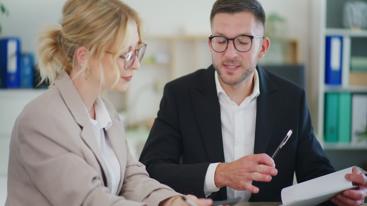 Business Negotiations Meeting: Businessman with Businesswoman